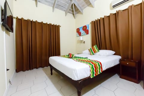 Deluxe Room, 1 Queen Bed, Kitchenette | In-room safe, iron/ironing board, free WiFi, bed sheets