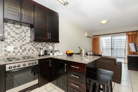 Two Bedroom Apartment with Balcony | Private kitchen | Full-size fridge, microwave, oven, stovetop