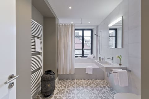 Suite | Bathroom | Rainfall showerhead, free toiletries, hair dryer, slippers