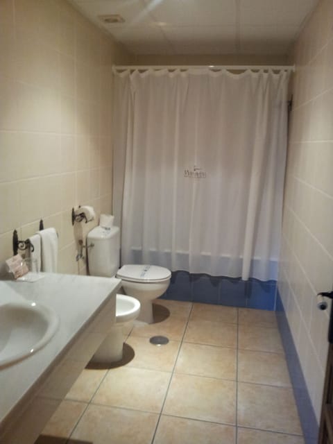 Bathroom | Bathtub, hair dryer, bidet, towels