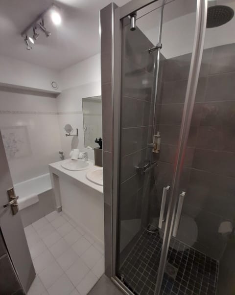 Separate tub and shower, free toiletries, hair dryer, slippers