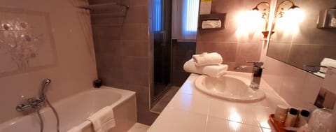 Separate tub and shower, free toiletries, hair dryer, slippers