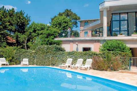 Seasonal outdoor pool, open 11:00 AM to 6:00 PM, sun loungers