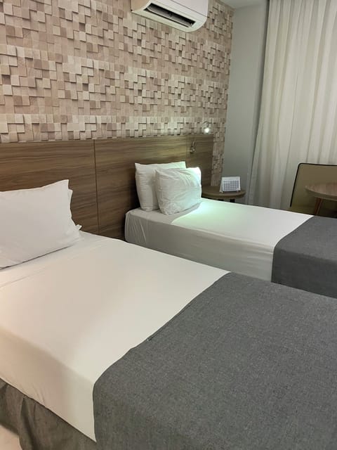 Deluxe Twin Room, 2 Twin Beds, Patio, City View | Minibar, in-room safe, desk, blackout drapes