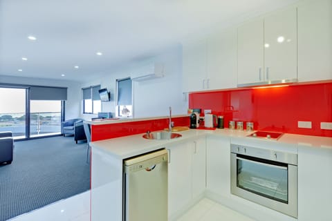 Ocean Deluxe Apartment (Upstairs with Balcony) | Private kitchen | Full-size fridge, microwave, oven, stovetop