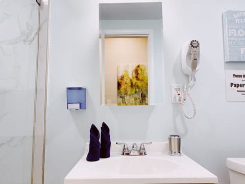 Deluxe Studio, Balcony | Bathroom | Shower, hair dryer, towels, soap