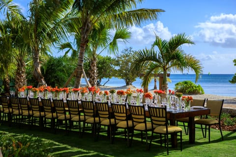 On the beach, white sand, beach cabanas, sun loungers