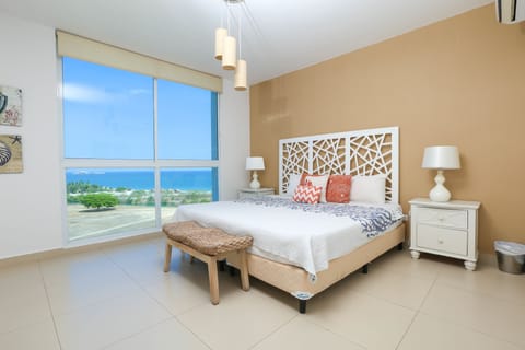 Apartment, 3 Bedrooms, Partial Sea View | Premium bedding, in-room safe, blackout drapes, iron/ironing board