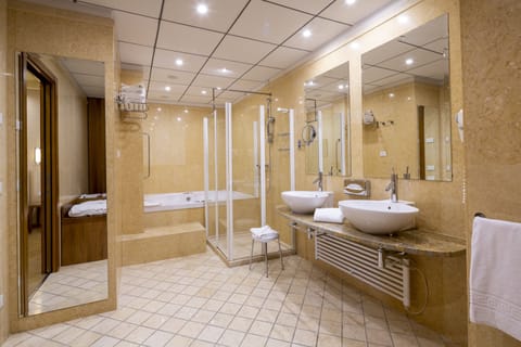 Suite, 1 King Bed (Living Area) | Bathroom | Combined shower/tub, hair dryer, bathrobes, bidet