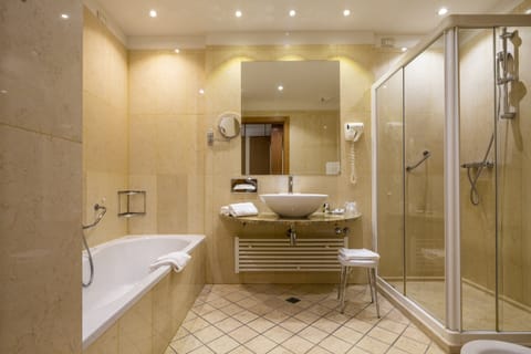 Suite, 1 King Bed (Living Area) | Bathroom | Combined shower/tub, hair dryer, bathrobes, bidet