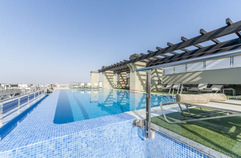 Seasonal outdoor pool, pool umbrellas, sun loungers