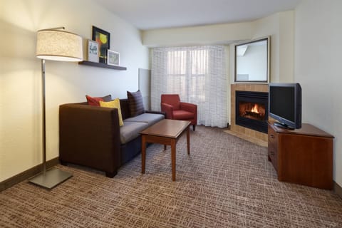 Suite, 2 Bedrooms | Living room | 32-inch flat-screen TV with cable channels, TV