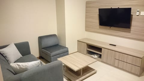 Junior Suite, 1 King Bed | Living area | LCD TV