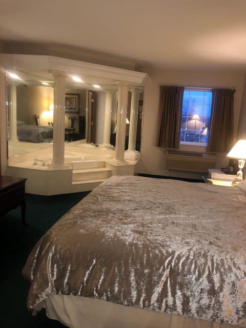 Suite, 1 King Bed, Jetted Tub | Individually decorated, individually furnished, iron/ironing board