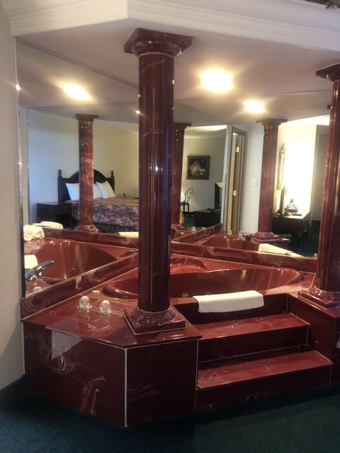 Suite, 1 King Bed, Jetted Tub | Individually decorated, individually furnished, iron/ironing board