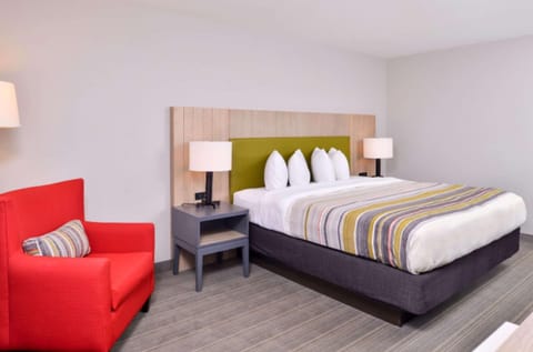 Junior Suite, 1 King Bed, Non Smoking | In-room safe, blackout drapes, soundproofing, iron/ironing board