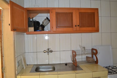 Apartment, 2 Bedrooms | Private kitchen | Full-size fridge, microwave, stovetop, coffee/tea maker