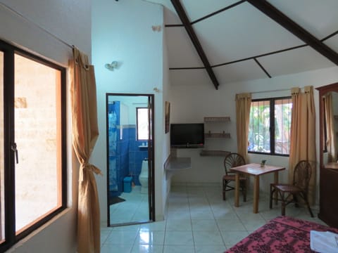 Deluxe Bungalow, 1 King Bed, Kitchenette, Garden Area | Living room | 32-inch flat-screen TV with cable channels, TV