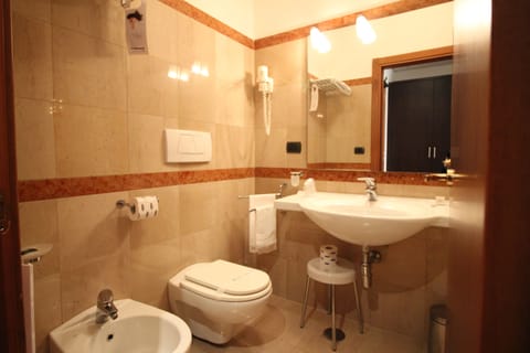 Standard Triple Room, Garden View | Bathroom | Shower, free toiletries, hair dryer, slippers