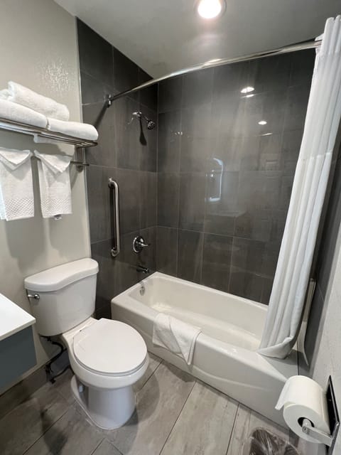 Standard Room, 2 Queen Beds, Non Smoking | Bathroom | Hair dryer, towels, soap, shampoo
