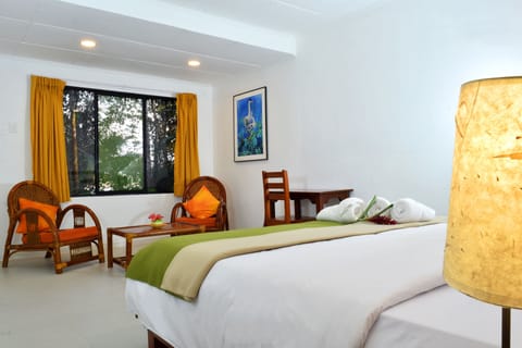 Junior Suite, Garden View | In-room safe, desk, bed sheets