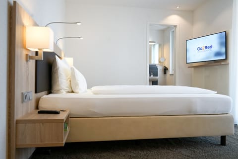 Comfort Double Room | Premium bedding, in-room safe, desk, soundproofing
