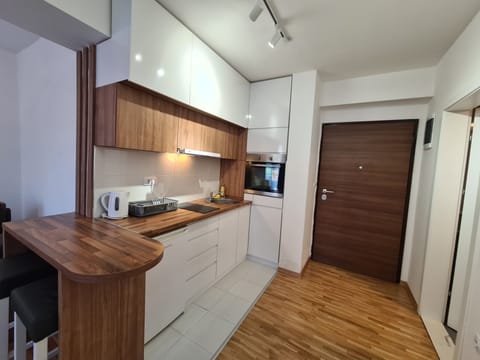 Deluxe Apartment Street Anastas Mitrev number 10 | Private kitchen | Full-size fridge, microwave, oven, stovetop