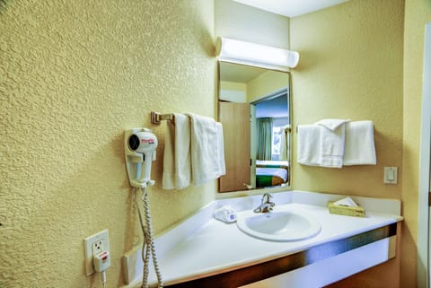 Combined shower/tub, hair dryer, towels, soap