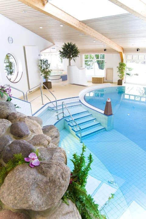 Indoor pool, open 7:00 AM to 9:00 PM, sun loungers