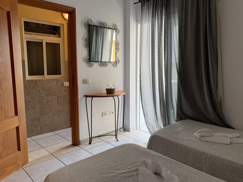 Twin Room, Private Bathroom | Blackout drapes, free WiFi