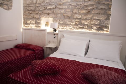 Triple Room | Minibar, blackout drapes, free WiFi