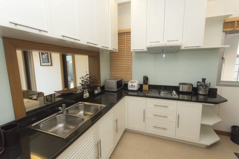 Exclusive Pool Villa | Private kitchen | Full-size fridge, microwave, oven, stovetop