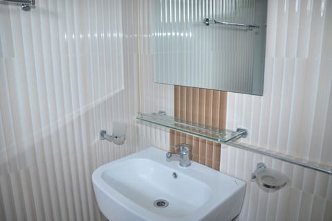 Family Studio Suite, 1 Bedroom, Garden View | Bathroom | Shower, free toiletries, towels