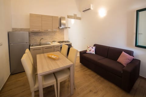 Comfort Apartment, 1 Bedroom | Living area | 32-inch flat-screen TV with digital channels, TV