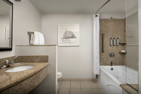 Suite, 1 Bedroom | Bathroom | Combined shower/tub, rainfall showerhead, free toiletries, hair dryer