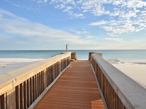 On the beach, white sand, sun loungers, beach umbrellas