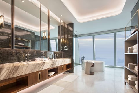 King, Presidential Suite, 1 King Bed | Bathroom | Combined shower/tub, hydromassage showerhead, hair dryer, bathrobes
