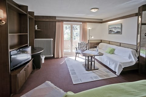 Triple Room, 1 Bedroom | Living area | Flat-screen TV