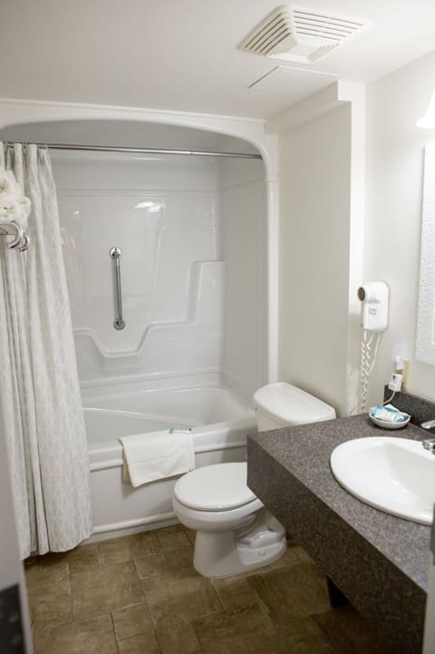 Standard Room, 2 Queen Beds | Bathroom | Combined shower/tub, free toiletries, hair dryer, towels