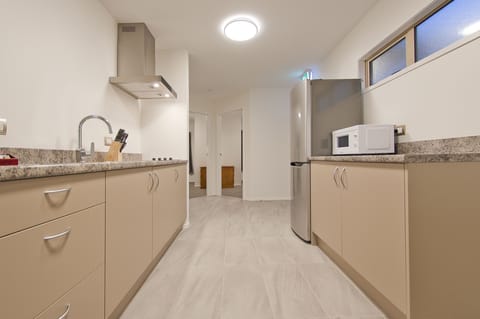 Suite, 2 Bedrooms, Jetted Tub | Private kitchen | Fridge, coffee/tea maker, electric kettle, cookware/dishes/utensils