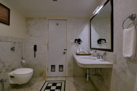 Vasundhara Room | Bathroom | Rainfall showerhead, designer toiletries, hair dryer, bathrobes