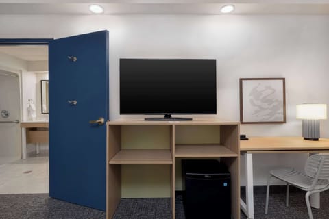 Desk, laptop workspace, blackout drapes, iron/ironing board