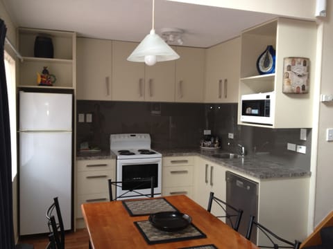 Family Room, 3 Bedrooms | Private kitchen | Fridge, microwave, stovetop, coffee/tea maker