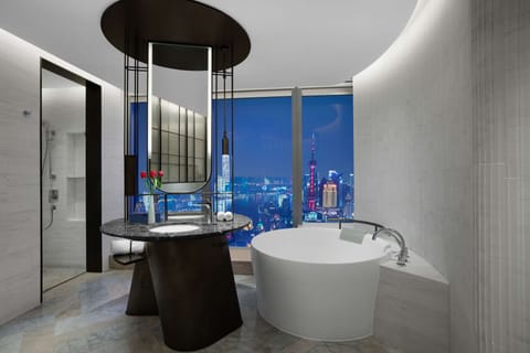 Premium Bund View Suite | Bathroom | Separate tub and shower, rainfall showerhead, designer toiletries