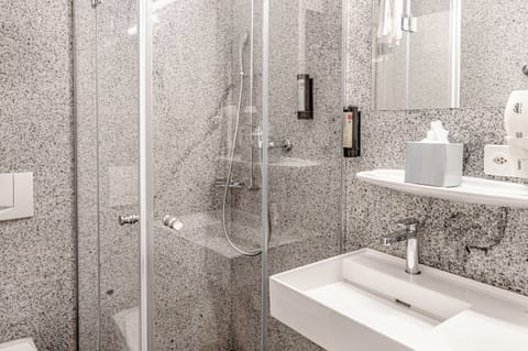 Shower, eco-friendly toiletries, hair dryer, towels