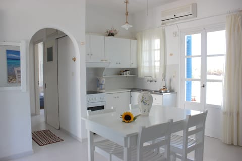 Apartment, 2 Bedrooms, Sea View | Private kitchen | Fridge, stovetop, electric kettle, cookware/dishes/utensils