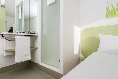 Triple Room, Multiple Beds | Bathroom | Shower, eco-friendly toiletries, hair dryer, towels