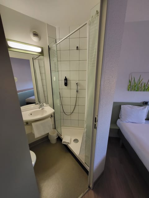 Shower, eco-friendly toiletries, hair dryer, towels