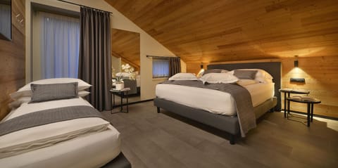 Family Room | Premium bedding, down comforters, minibar, in-room safe