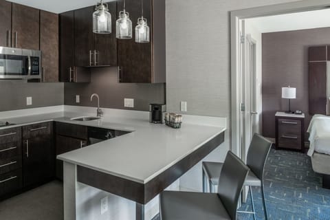 Suite, 1 Bedroom | Private kitchen | Full-size fridge, microwave, stovetop, dishwasher